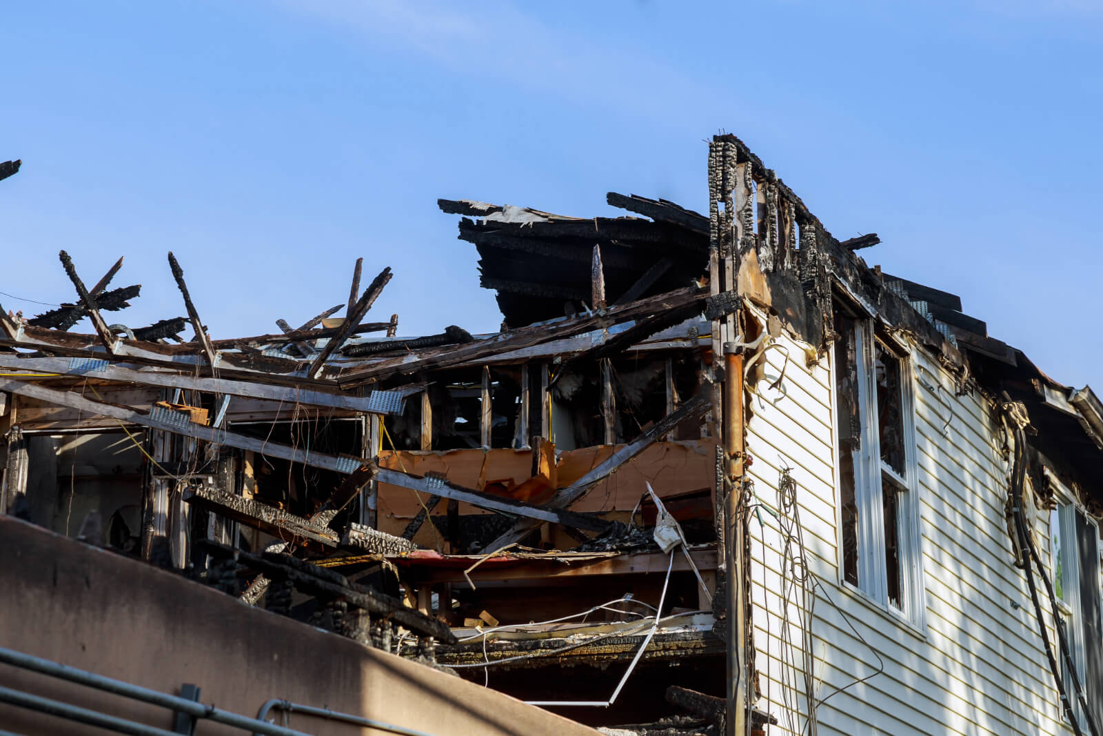 Burnt, charred home destroyed by fire